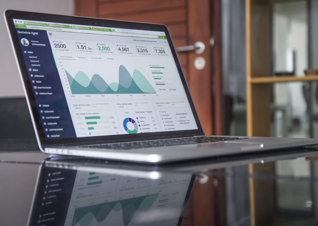TwinForge Management planner dashboard on laptop